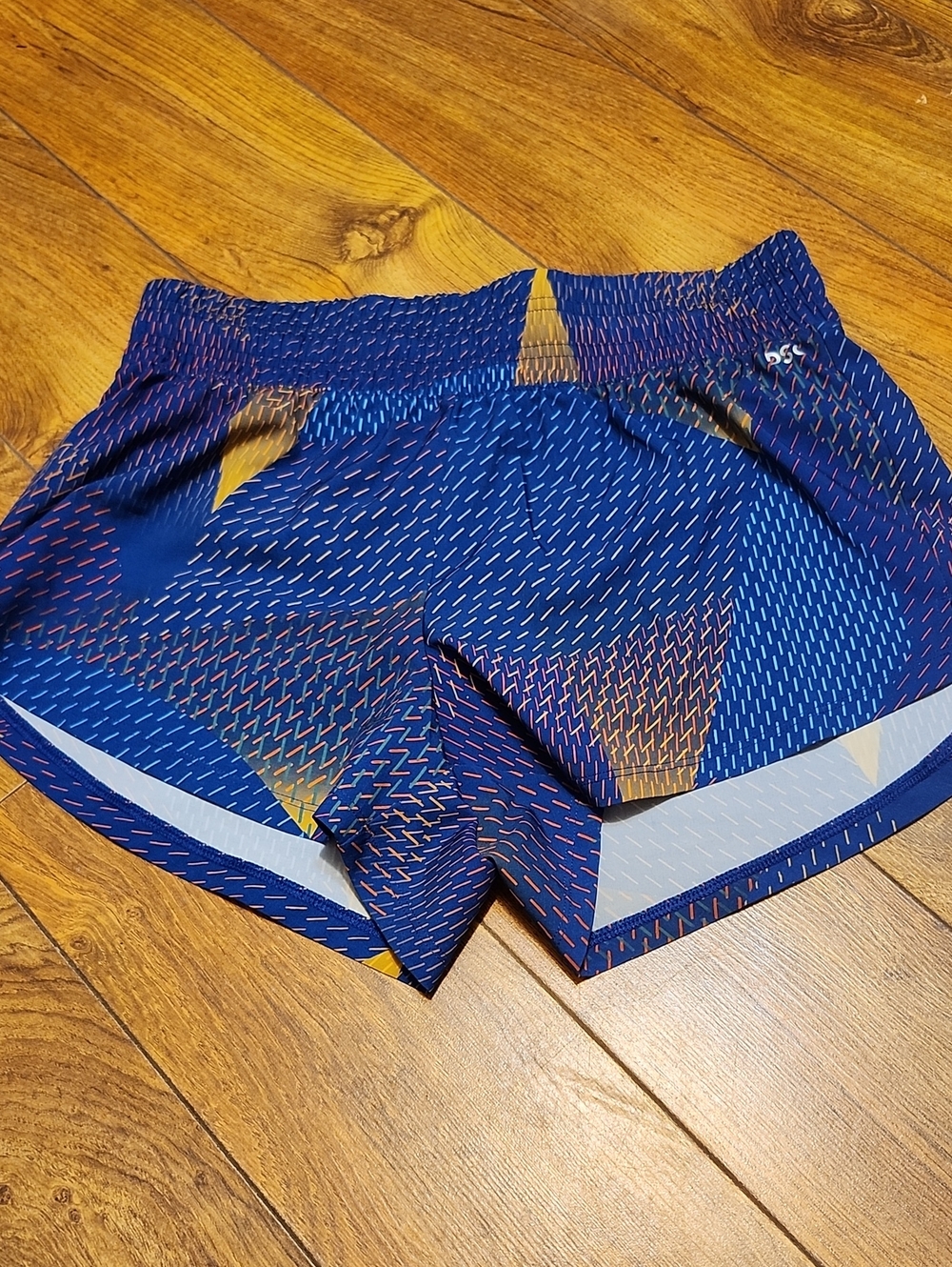 DSG Women's Blue Printed Athletic Shorts with Gold Accent